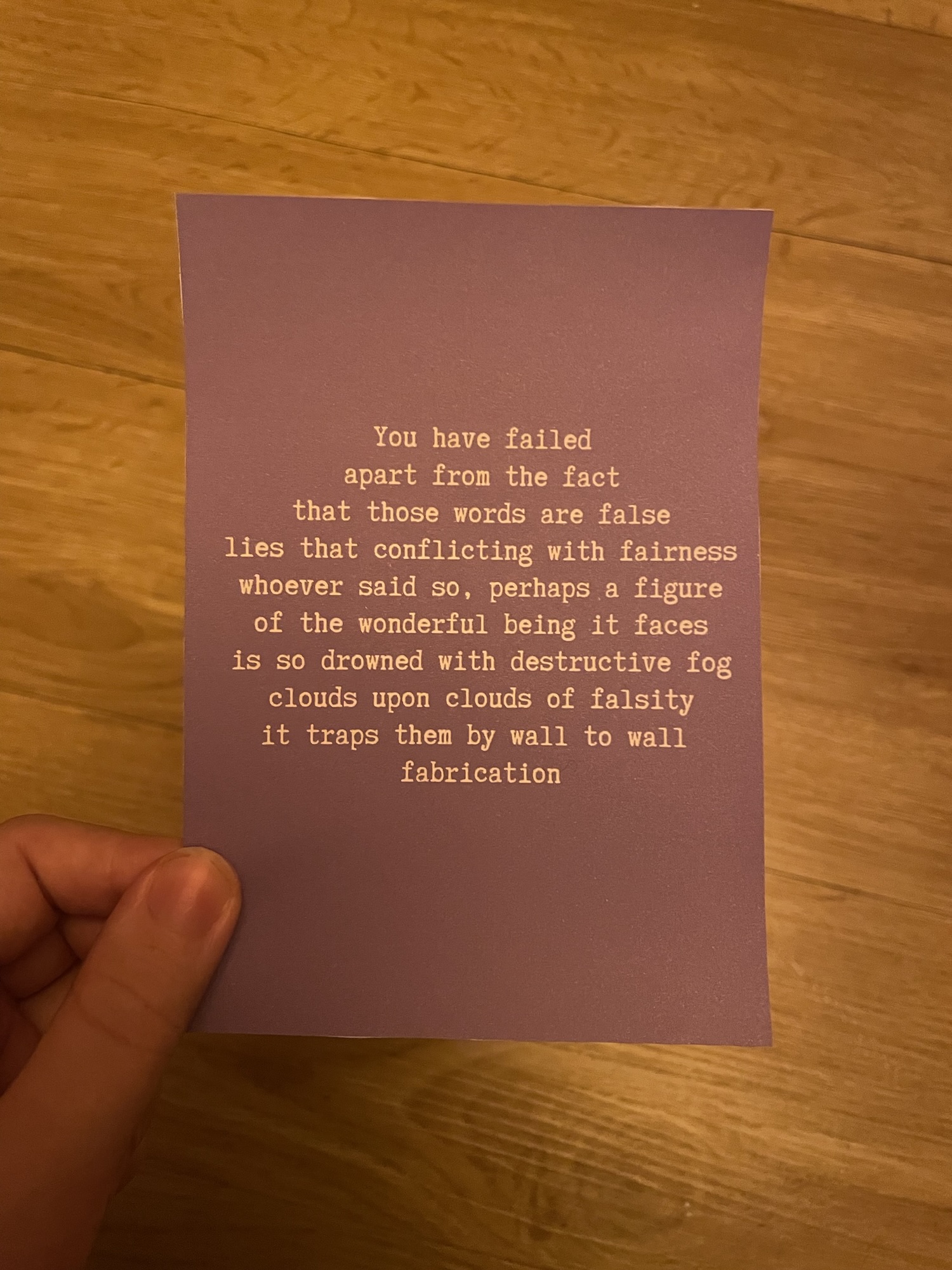 The Zebra With Rainbow Stripes’ “Falsity Clouds” poem in white text on a purple background 